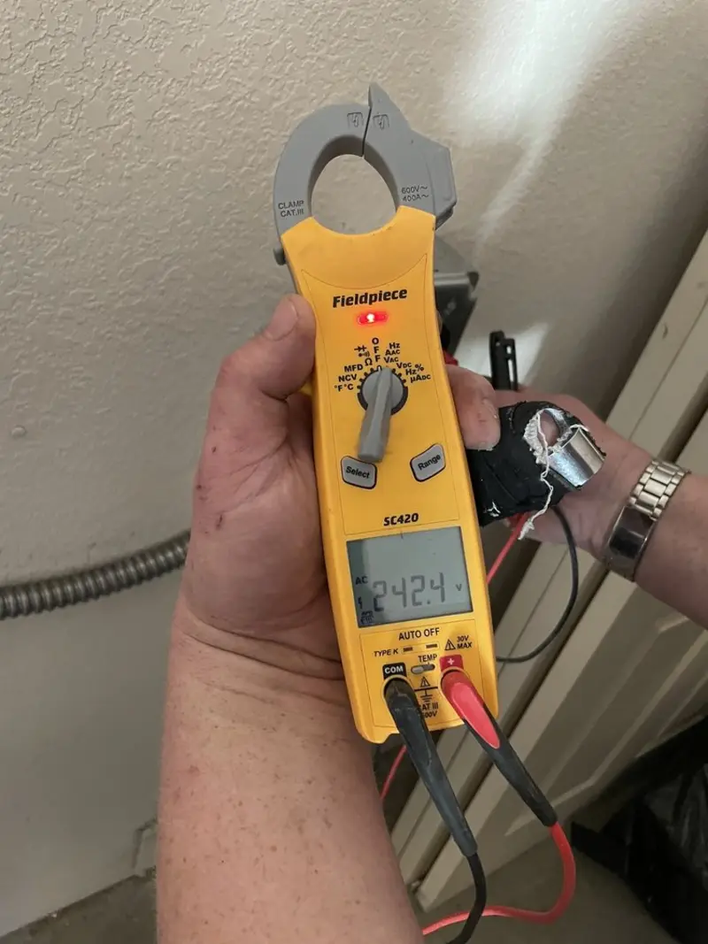 Voltage testing with clamp meter during Ceiling Fan Installation in Whitehall
